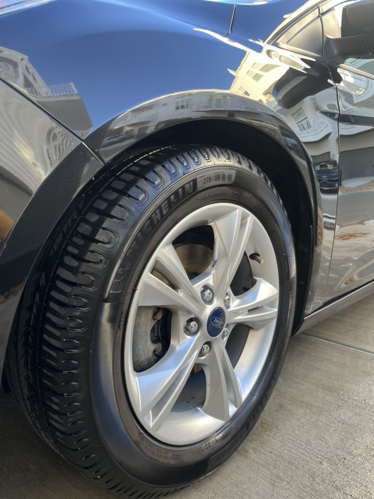 Glossy black car after full detail